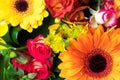 Bright yellow and orange gerbera and roses in a bouquet of flowers. Beautiful bouquet gift for the holiday.