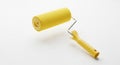Bright Yellow Paint Roller with a Yellow Handle on a White Background painting tool Royalty Free Stock Photo