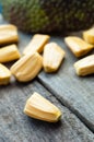 Bright yellow pieses of jackfruit on wooden background Royalty Free Stock Photo