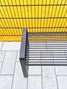 Bright yellow playground and metal bench