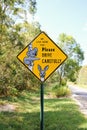 A sign with koalas, alerting drivers to take extra care when driving due to the presence of koalas