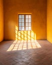 Bright Yellow Room with Window and Shadow Patterns Royalty Free Stock Photo