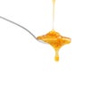 bright yellow sauce in a spoon on a white Royalty Free Stock Photo