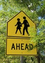 Bright yellow sign for pedestrian crossing Royalty Free Stock Photo