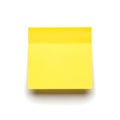 A bright yellow square of sticky notes ready for use on a white background Royalty Free Stock Photo