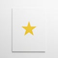A bright yellow star centered on a plain white rectangular sheet or Royalty Free Stock Photo