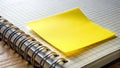 Bright Yellow Sticky Note Highlights Important Task on Open Notebook Displaying a Seamlessly Integrated App Interface