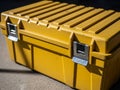 Bright yellow storage box with secure latches Royalty Free Stock Photo