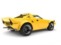 Bright yellow vintage sports race car - rear view Royalty Free Stock Photo