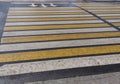 Bright yellow and white stripes of zebra crossing, pedestrian crosswalk Royalty Free Stock Photo