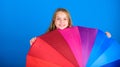 Brighten up life. Kid peek out colorful rainbow umbrella. Color your life. Girl cheerful hide behind umbrella. Colorful