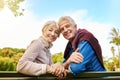 Brighter days are here. Portrait of a happy senior couple sitting on a park bench. Royalty Free Stock Photo