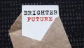 BRIGHTER FUTURE. text on white paper on vintage envelope on dark background. View from above. Marketing concept Royalty Free Stock Photo