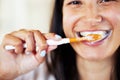 For a brighter, more beautiful smile. Closeup shot of a beautiful young woman brushing her teeth. Royalty Free Stock Photo