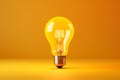 The brightest light bulb captures attention against a yellow background