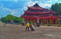 A brightful morning from a worker in front of a temple