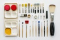 Brightly arranged hobby and DIY tools such as brushes, scissors, and paints create an inviting workspace, perfect for