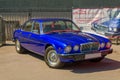 Brightly blue British luxery car Jaguar X-Type