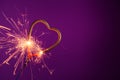 Brightly burning sparkler heart shaped. Love wedding valentines day