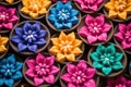 brightly colored clay diwali diyas arranged in a circle