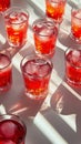 Brightly colored drinks arranged on a striped surface with reflections in sunlight Royalty Free Stock Photo