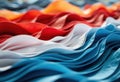 Colorful fabric waves in red, white, and blue create a vibrant, flowing pattern Royalty Free Stock Photo