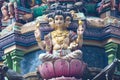 Brightly colored Hindu-themed statues outside of Batu Caves