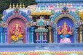 Brightly colored Hindu-themed statues outside of Batu Caves