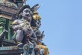 Brightly colored Hindu-themed statues outside of Batu Caves