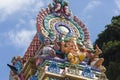 Brightly colored Hindu-themed statues outside of Batu Caves