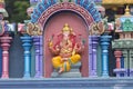 Brightly colored Hindu-themed statues outside of Batu Caves