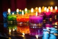 brightly colored homemade candles on a reflectively lit surface Royalty Free Stock Photo