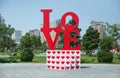 A brightly colored, outdoor sculpture in a public park in Azerbaijan consists of red letters spelling LOVE . Love red letters in Royalty Free Stock Photo