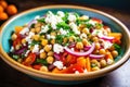 a brightly colored salad with chickpeas and feta cheese