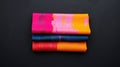 Brightly colored textiles arranged in vibrant layers on a dark background showcasing artistic patterns and textures Royalty Free Stock Photo