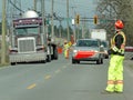Brightly colored workers control traffic