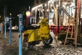 Brightly colored yellow scooter parked in a street Royalty Free Stock Photo