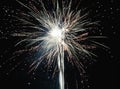 Brightly colorful explosive fireworks light up the night sky at New Year`s eve celebrations. Happy New Year 2017 and holidays