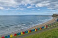 Brightly coloured beach huts, Whitby, North Yorkshire.