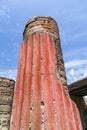 Brightly coloured classical column at Herculaneum, Italy