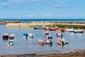 Colourful Staithes harbour full of brightly coloured bobbing fishing boats. Royalty Free Stock Photo