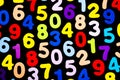 Brightly coloured numbers on black background