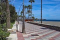 The brightly coloured, patterned esplanade runs by the side of the wide beach of Estepona in Spain