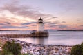 Brightly coloured skies reflect off the Bug Light in Portland, Maine.