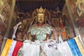 Brightly coloured statues of Tibetan deities inside the Buddhist Kumbum chorten in Gyantse in the Pelkor Chode Monastery