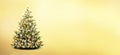 Brightly decdecorated Christmas tree isolated on golden background Royalty Free Stock Photo