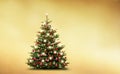 Brightly decorated Christmas tree isolated on golden background Royalty Free Stock Photo