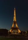 Brightly illuminated Eiffel Tower at night in late October