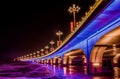 Brightly lit bridge at night