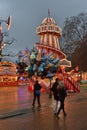 Brightly lit colourful fairground helter skelter